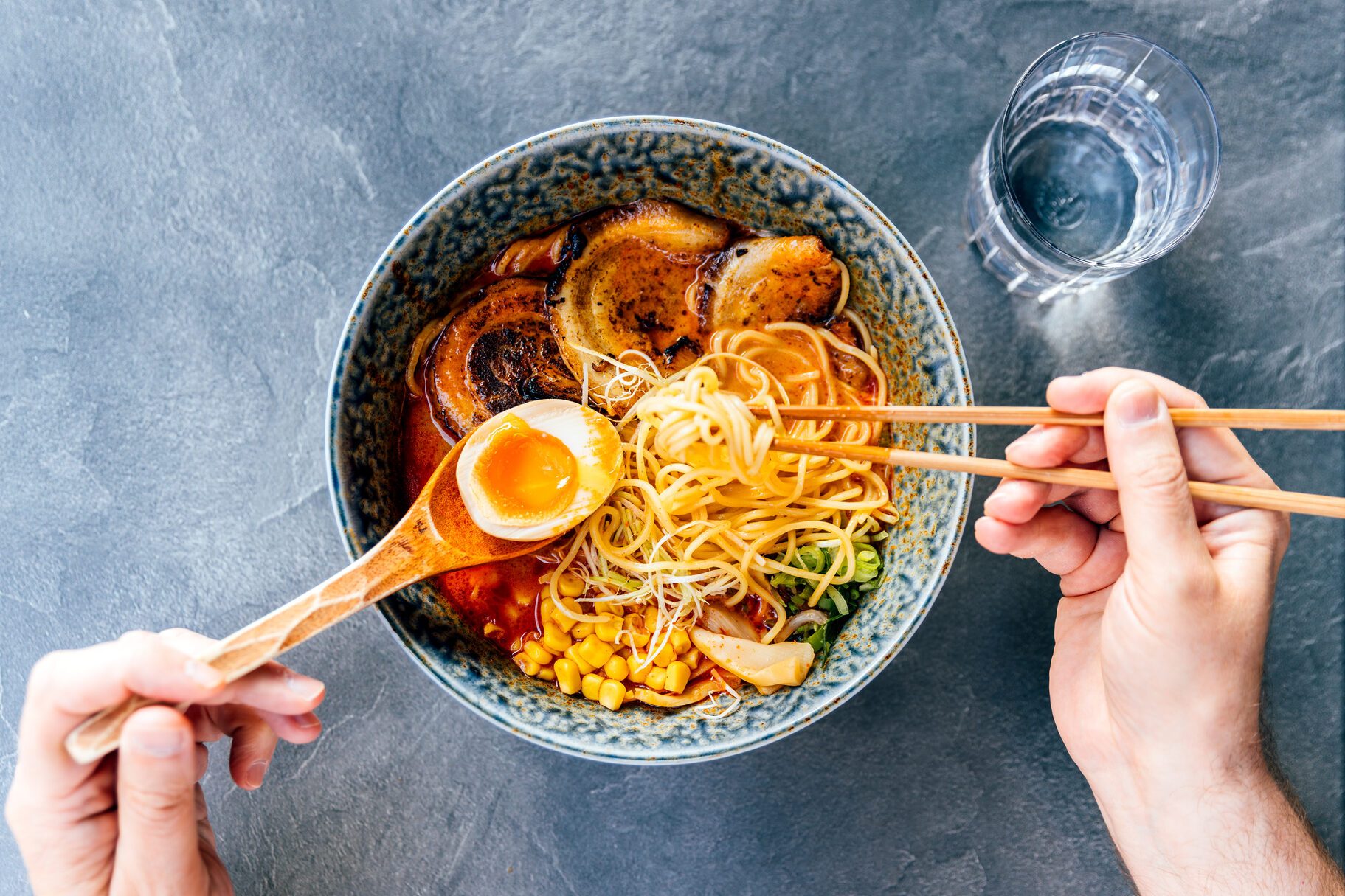 Man eating tonkotsu ramen